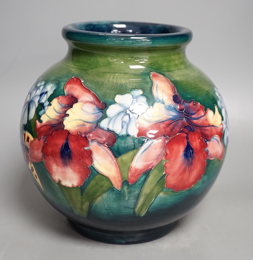 A Moorcroft green glaze 'spring flowers' squat vase, 21 cms high.